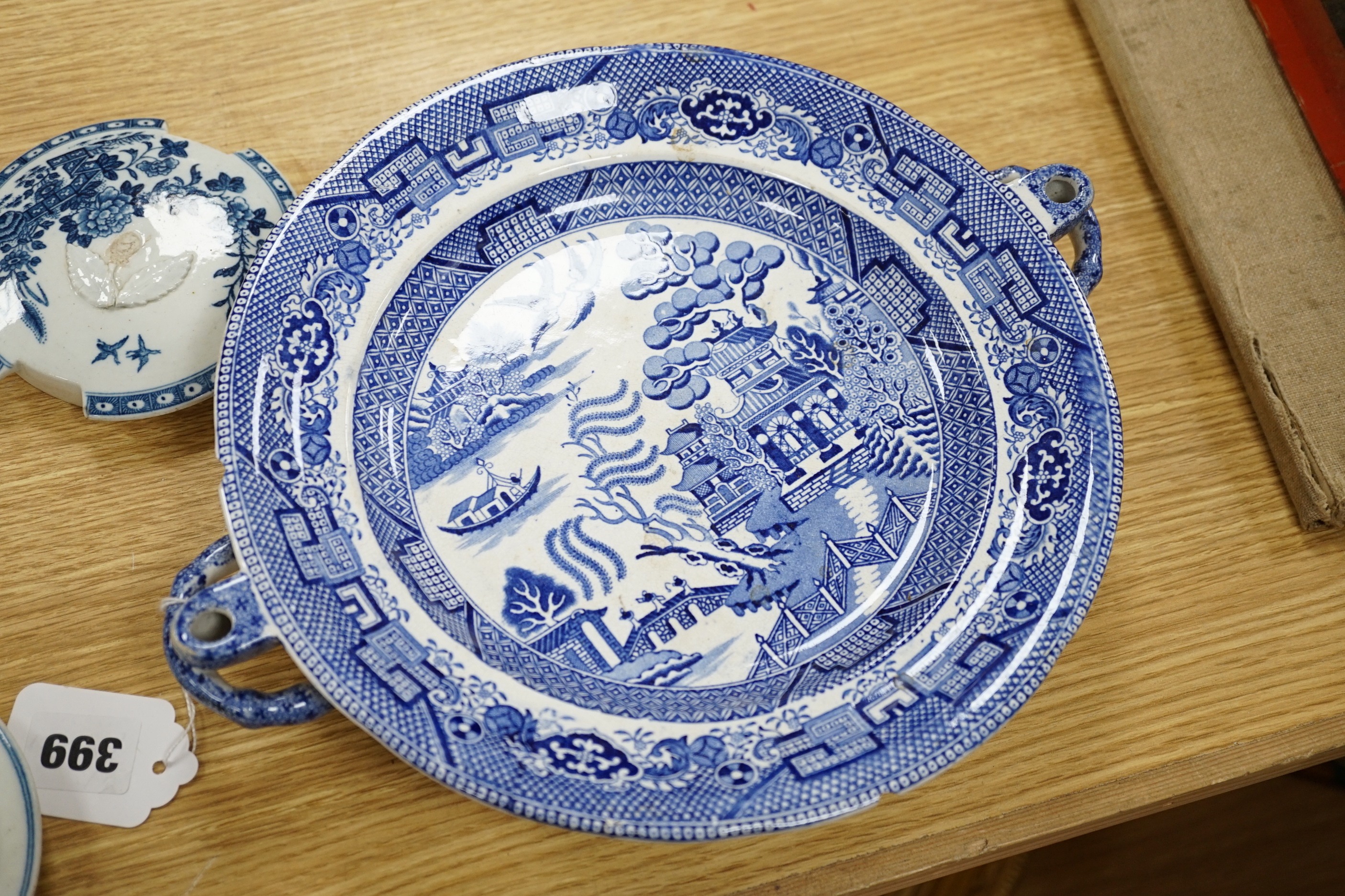 A 19th century Abbotsford pattern blue and white tureen and cover, various dishes and a collection of early Worcester tea and coffee pot covers